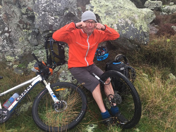 ee fixes a puncture on the Remutaka Cycle Trail (Sarah Bennett).