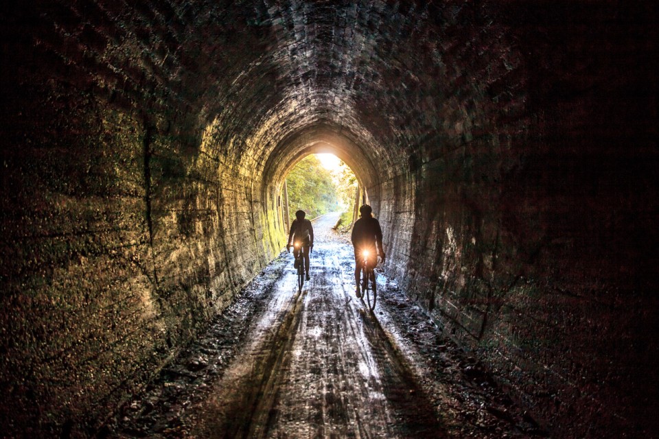Cyclists Inside Spooners Tunnel on Tasmans Great Taste Trail credit George Guille Media